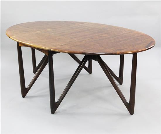 Kurt Ostervig for Jason Mobler, Denmark, 1960s. A rosewood drop-leaf dining table extends to 6ft 4.5in.